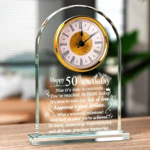 Freestanding Ornalrist 50th birthday quartz clock made from polished multi-faceted glass with a 50 and Fabulous engraving, displayed as a luxury milestone home ornament.