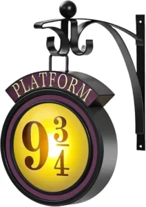 Vintage style Platform 9 3/4 hanging wall night light on a decorative bracket, used as a magical prop for a 9 and 3/4 birthday party and wizard home decor.
